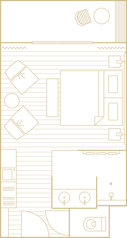 Floor plan with a bed, two chairs, a desk, a bathroom with double sinks and an outdoor balcony.