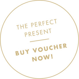 Beige circle with text: The perfect gift - buy voucher now! in bold capital letters.
